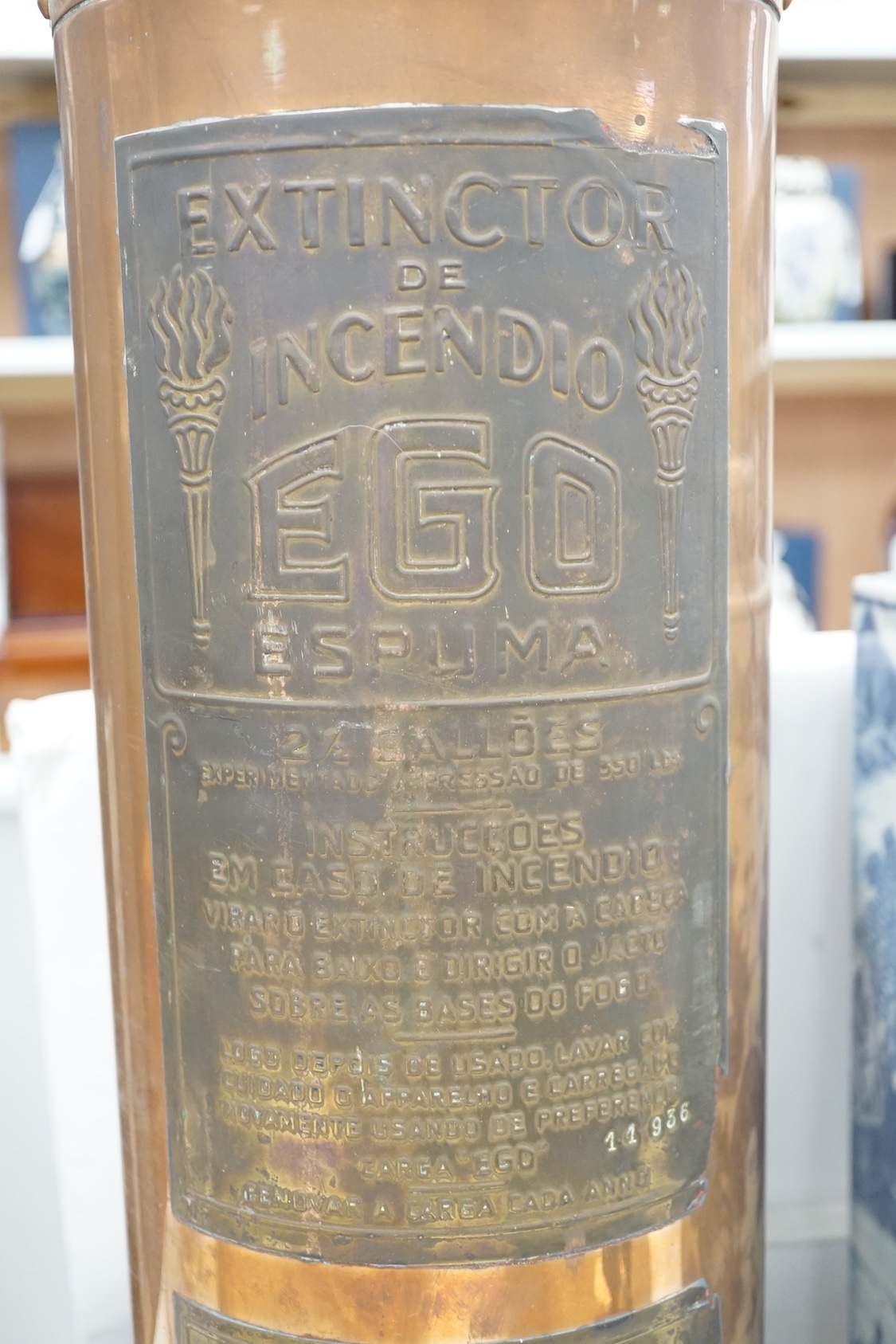 A Spanish copper fire extinguisher, 60cm